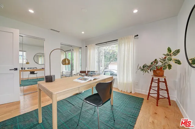 a workspace with furniture and window