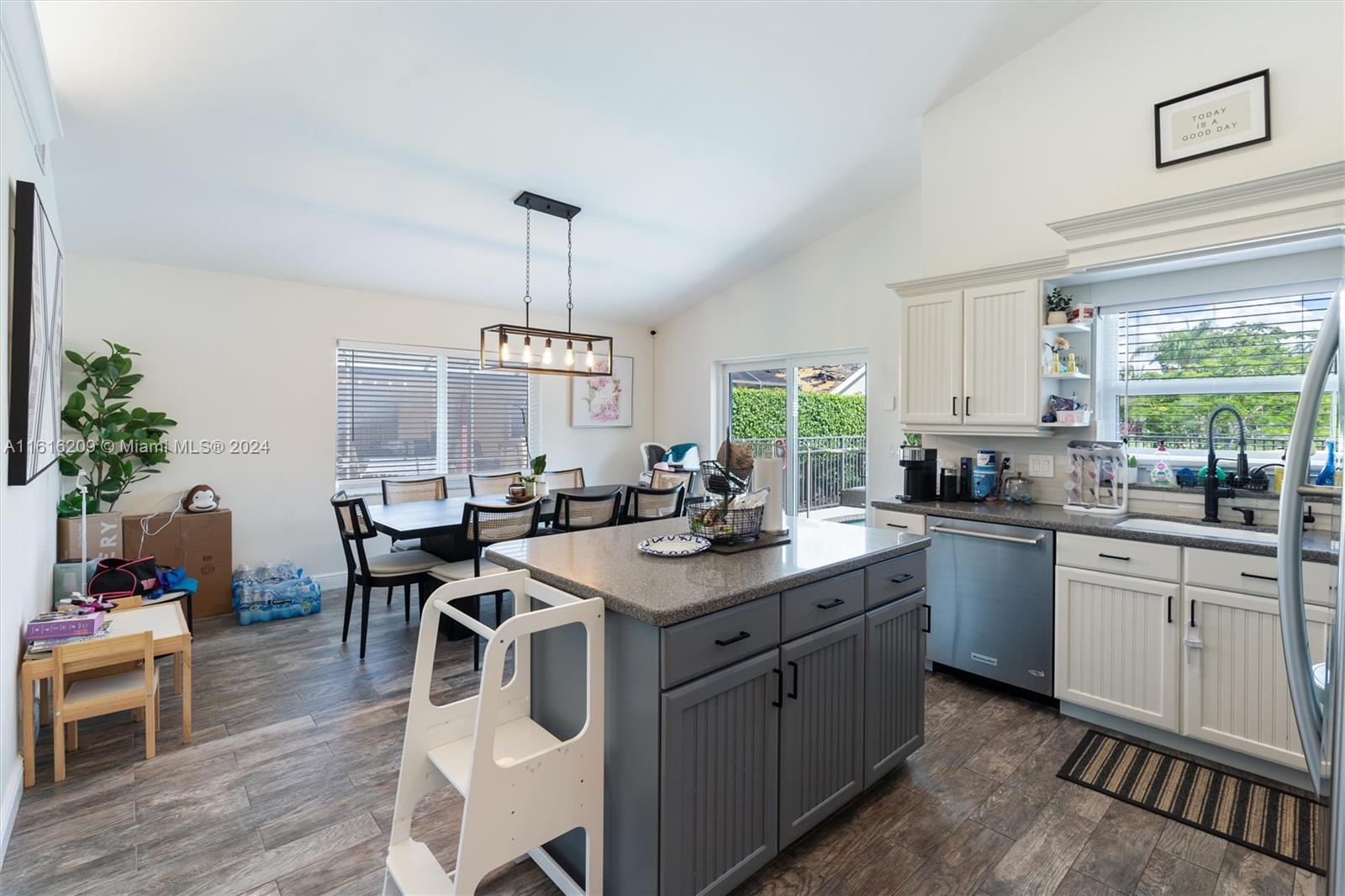 22397 Swordfish Drive Boca Raton, FL 33428 - Photo 5 of 20 a kitchen with stainless steel appliances granite countertop a sink stove and cabinets