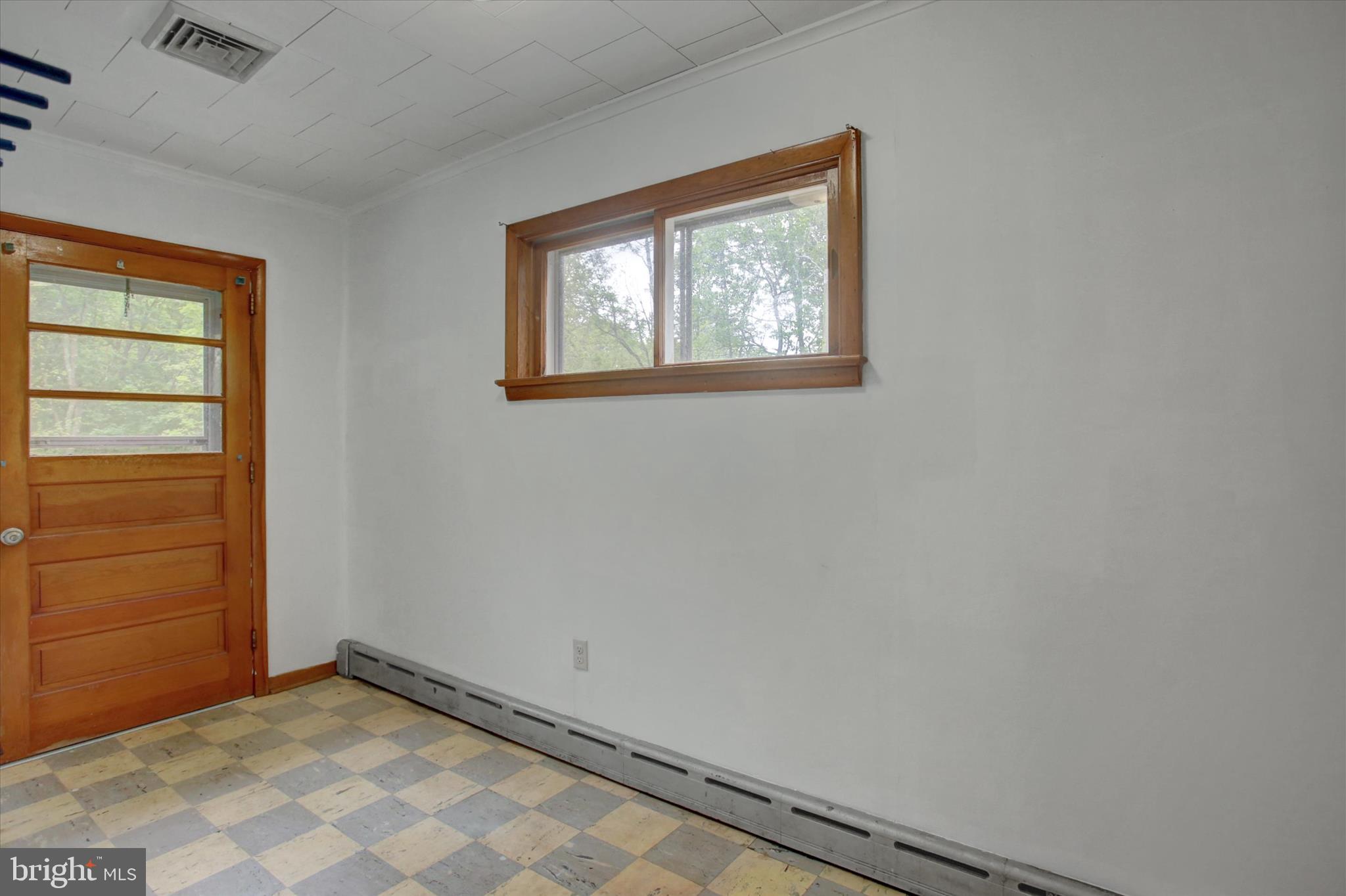 5156 Peach Orchard Road McConnellsburg, PA 17233 - Photo 15 of 34 an empty room with windows