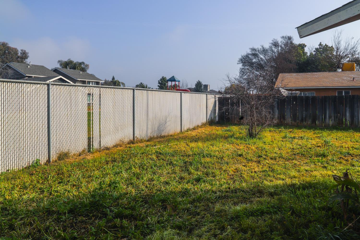 223 South Kady Avenue Reedley, CA 93654 - Photo 23 of 24 a view of a backyard with a small cabin