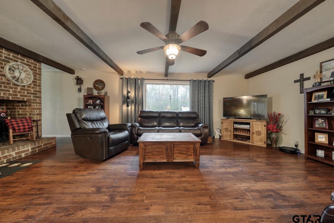 11656 Constantine Avenue Tyler, TX 75708 - Photo 2 of 26 a living room with furniture and a flat screen tv