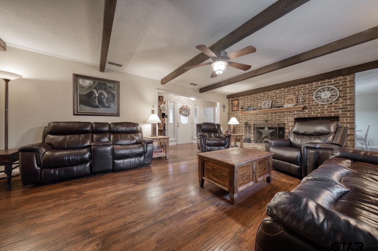 11656 Constantine Avenue Tyler, TX 75708 - Photo 4 of 26 a living room with furniture and a fireplace