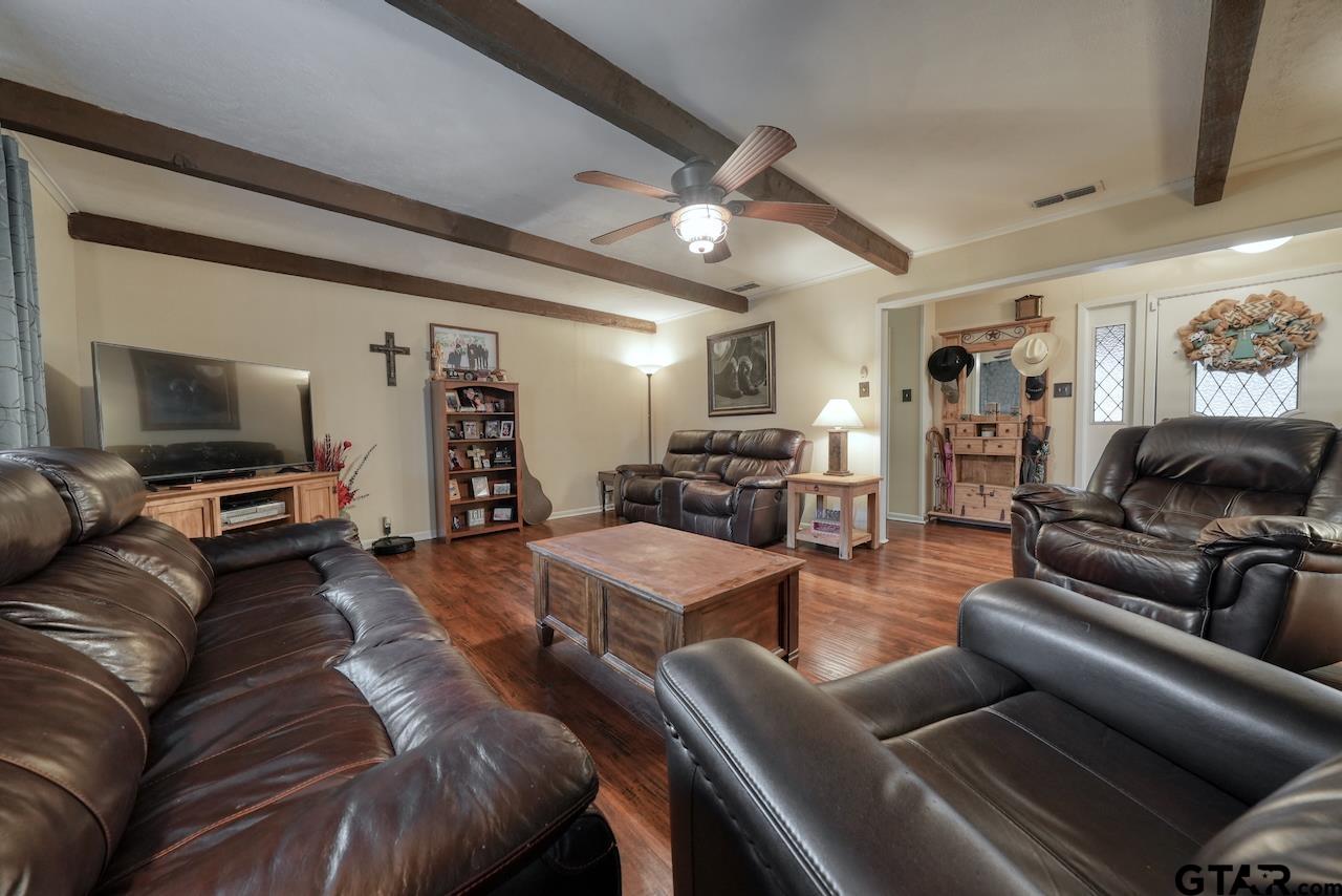 11656 Constantine Avenue Tyler, TX 75708 - Photo 7 of 26 a living room with furniture and a flat screen tv