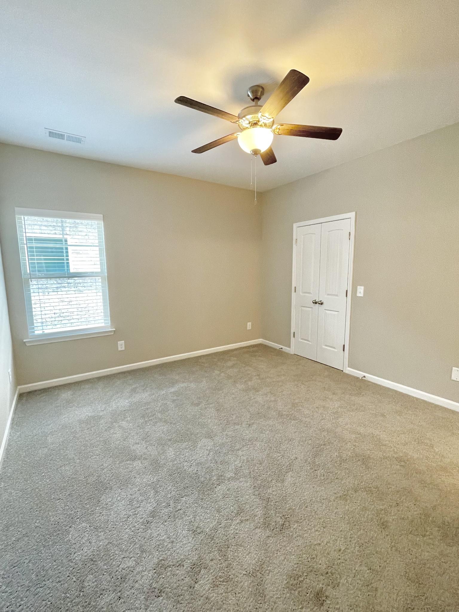 710 Rex Dr Spring Hill Spring Hill, TN 37174 - Photo 17 of 21 an empty room with windows and fan