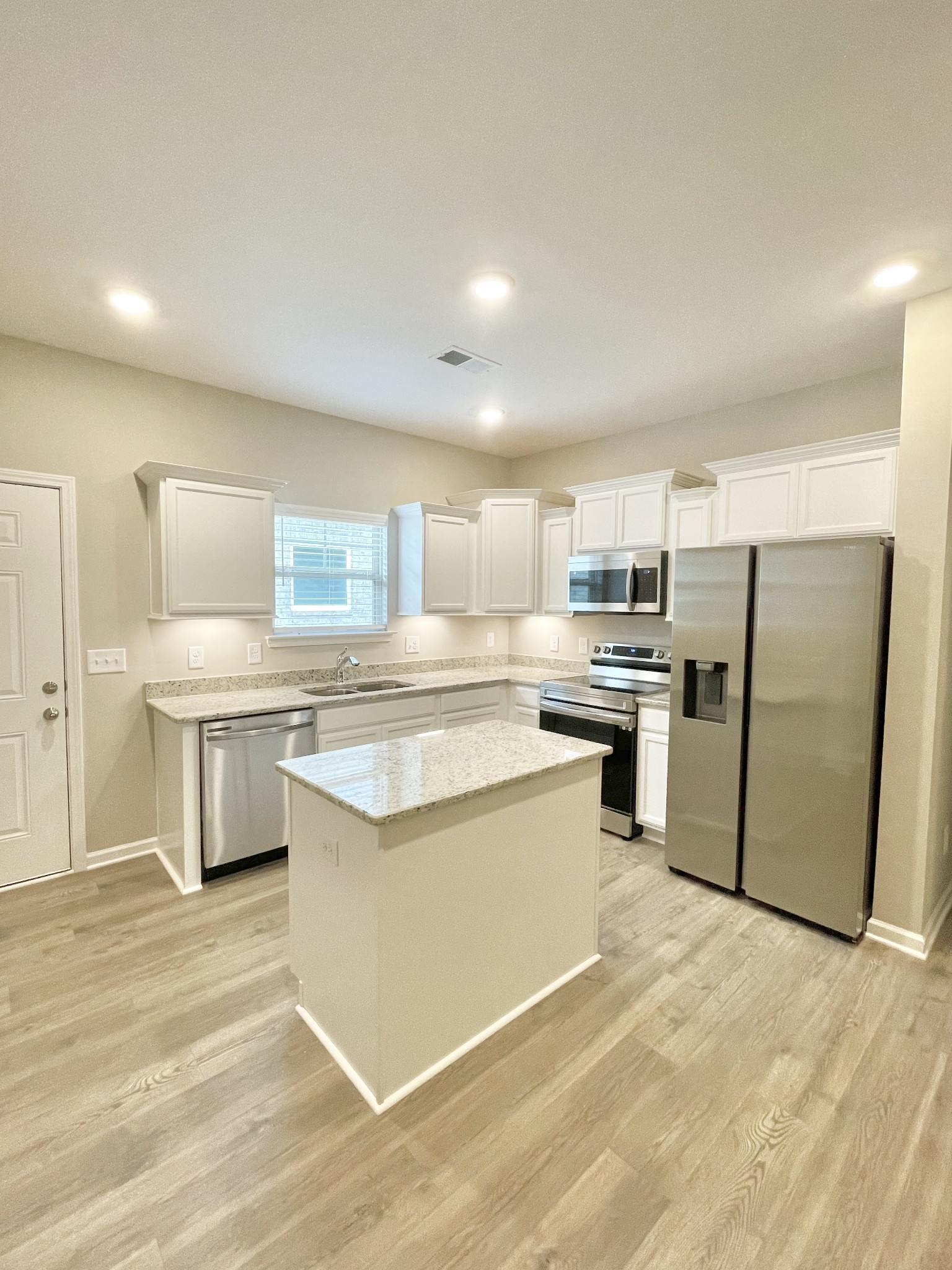 710 Rex Dr Spring Hill Spring Hill, TN 37174 - Photo 18 of 21 a kitchen with stainless steel appliances a refrigerator sink and cabinets