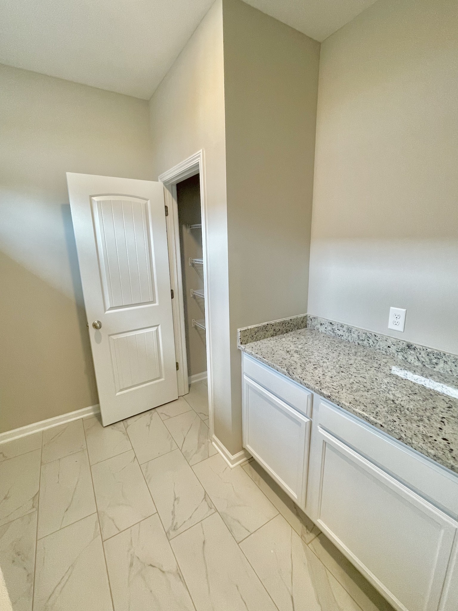 710 Rex Dr Spring Hill Spring Hill, TN 37174 - Photo 8 of 21 a view of a refrigerator in kitchen and wooden floor