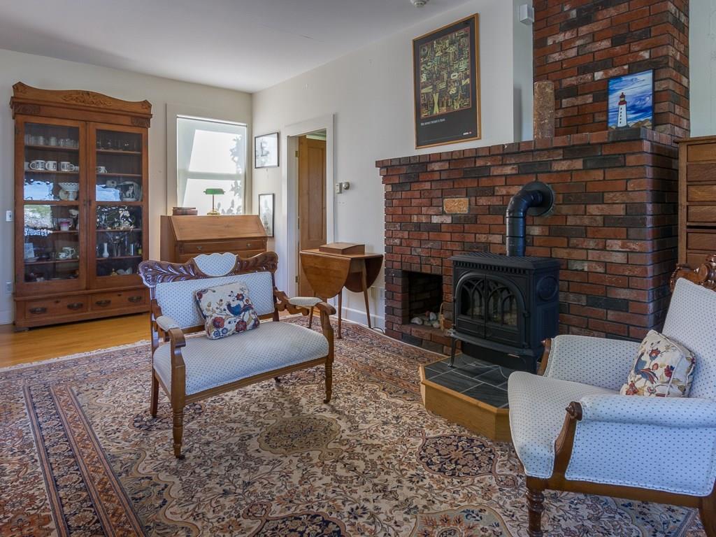 30 Steamboat Wharf Road Tremont, ME 04612 - Photo 11 of 31 The gas stove with a brick mantal...