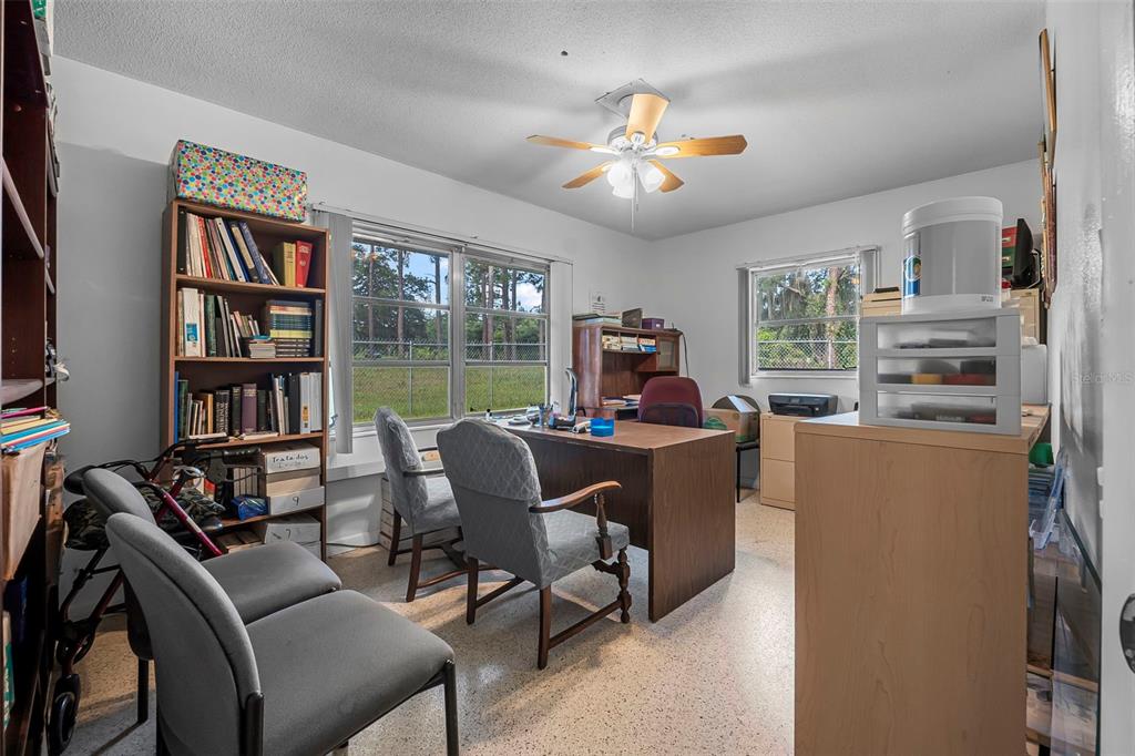 2620 Doyle Road Deltona, FL 32738 - Photo 11 of 54 a view of a livingroom with furniture and a bookshelf