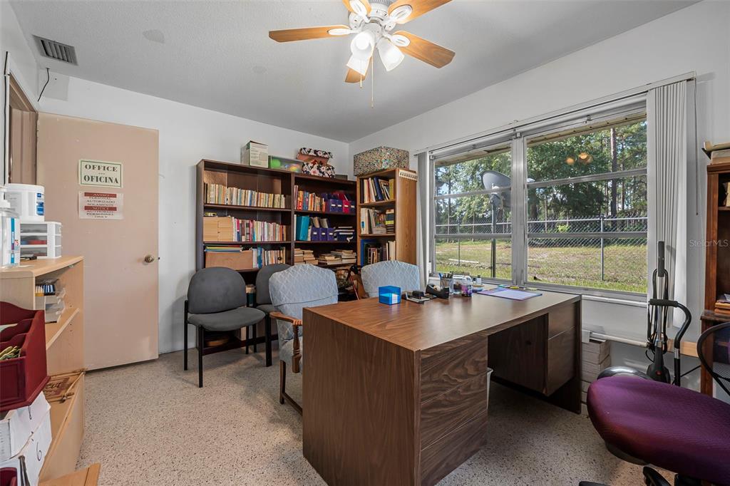 2620 Doyle Road Deltona, FL 32738 - Photo 12 of 54 a room with a large window and furniture