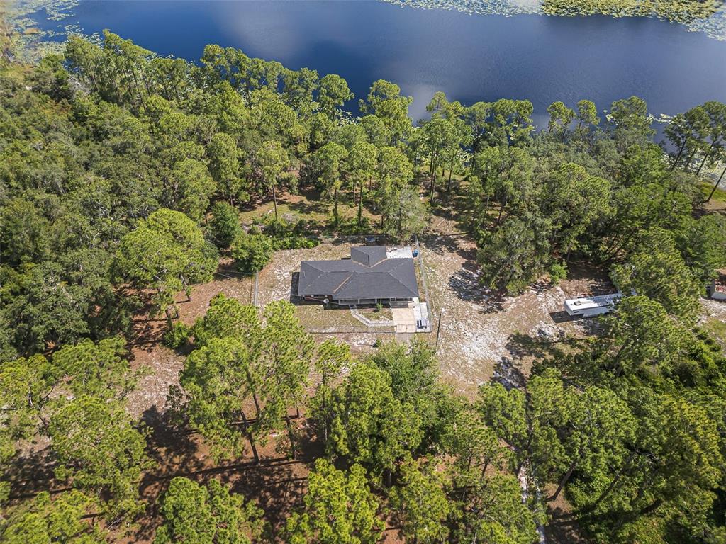 2620 Doyle Road Deltona, FL 32738 - Photo 17 of 54 an aerial view of a house with a yard