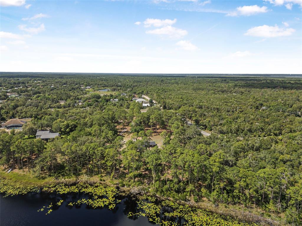 2620 Doyle Road Deltona, FL 32738 - Photo 19 of 54 an aerial view of residential houses with outdoor space