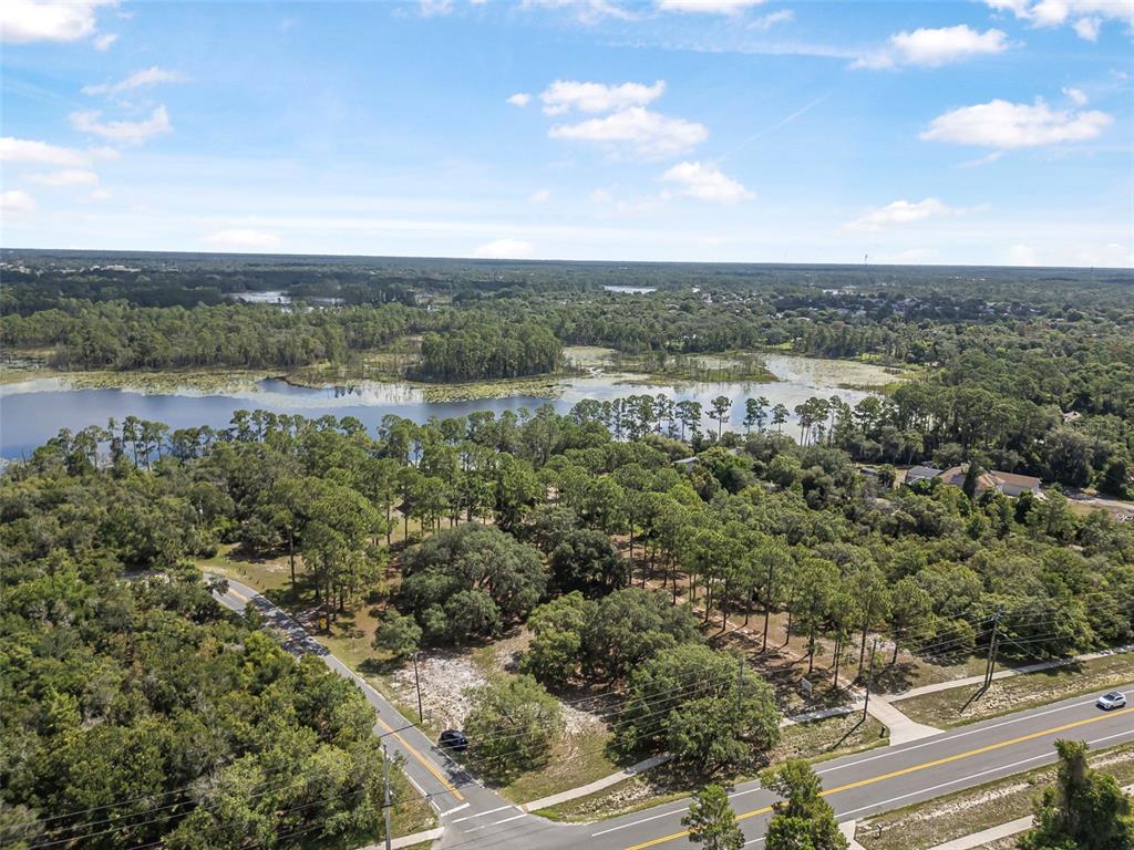 2620 Doyle Road Deltona, FL 32738 - Photo 24 of 54 an aerial view of a houses with outdoor space