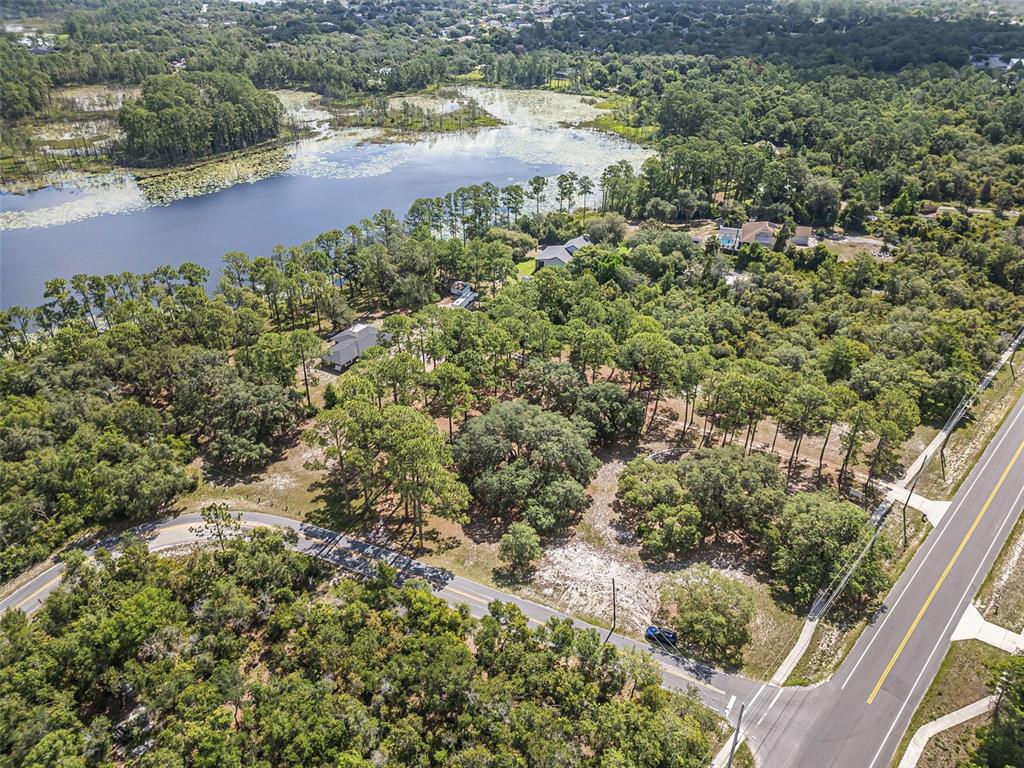 2620 Doyle Road Deltona, FL 32738 - Photo 28 of 54 a view of a lake with a yard