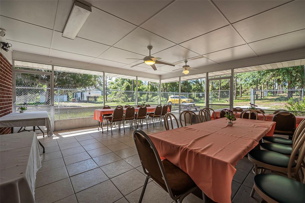 2620 Doyle Road Deltona, FL 32738 - Photo 29 of 54 a view of a dining area with furniture window and outside view