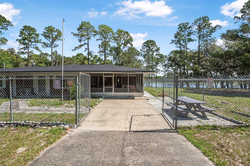 2620 Doyle Road Deltona, FL 32738 - Photo 33 of 54 a view of a house with a swimming pool
