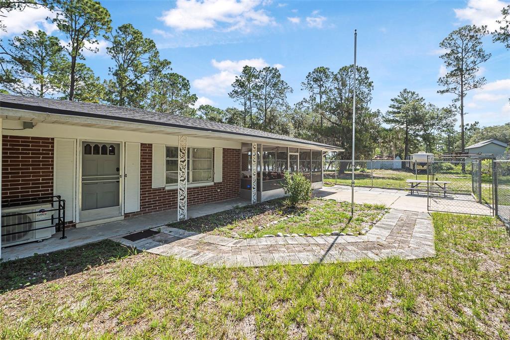 2620 Doyle Road Deltona, FL 32738 - Photo 34 of 54 a view of a house with backyard and sitting area