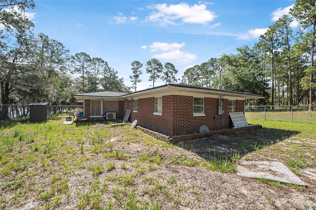 2620 Doyle Road Deltona, FL 32738 - Photo 36 of 54 a front view of a house with a yard