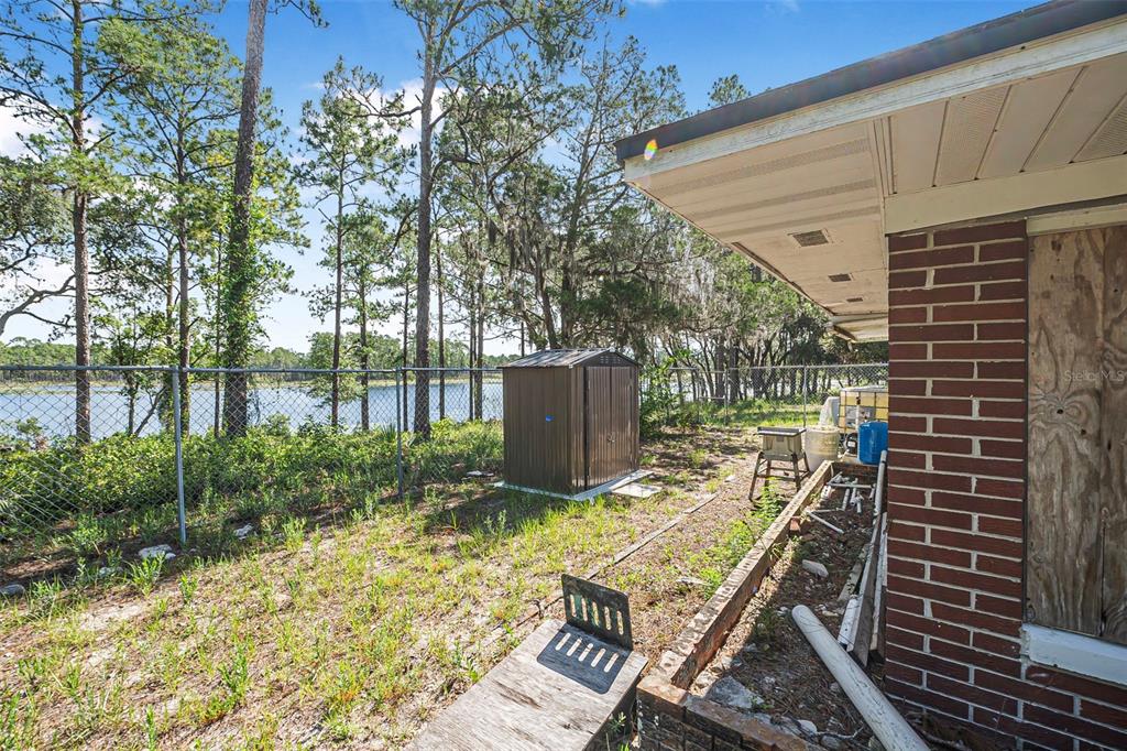2620 Doyle Road Deltona, FL 32738 - Photo 37 of 54 a view of a backyard with sitting area