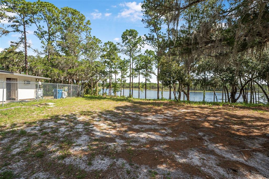 2620 Doyle Road Deltona, FL 32738 - Photo 41 of 54 a view of a house with a yard