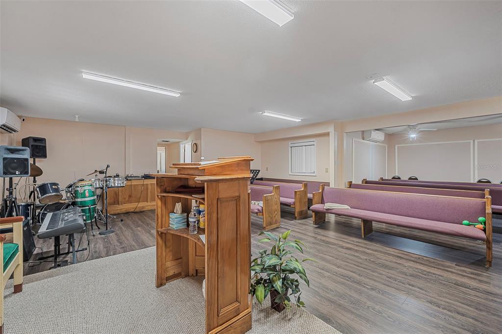 2620 Doyle Road Deltona, FL 32738 - Photo 8 of 54 a living room with furniture and a wooden floor