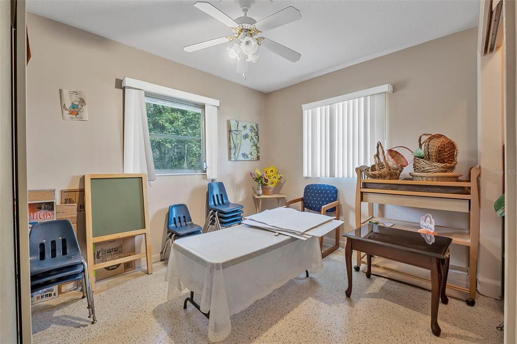 2620 Doyle Road Deltona, FL 32738 - Photo 9 of 54 a workspace with furniture and a window