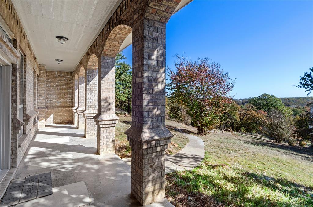 396 Ranchview Court Bowie, TX 76230 - Photo 20 of 38 a view of a pathway of a house with a yard