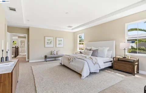 a bed room with a bed and a window