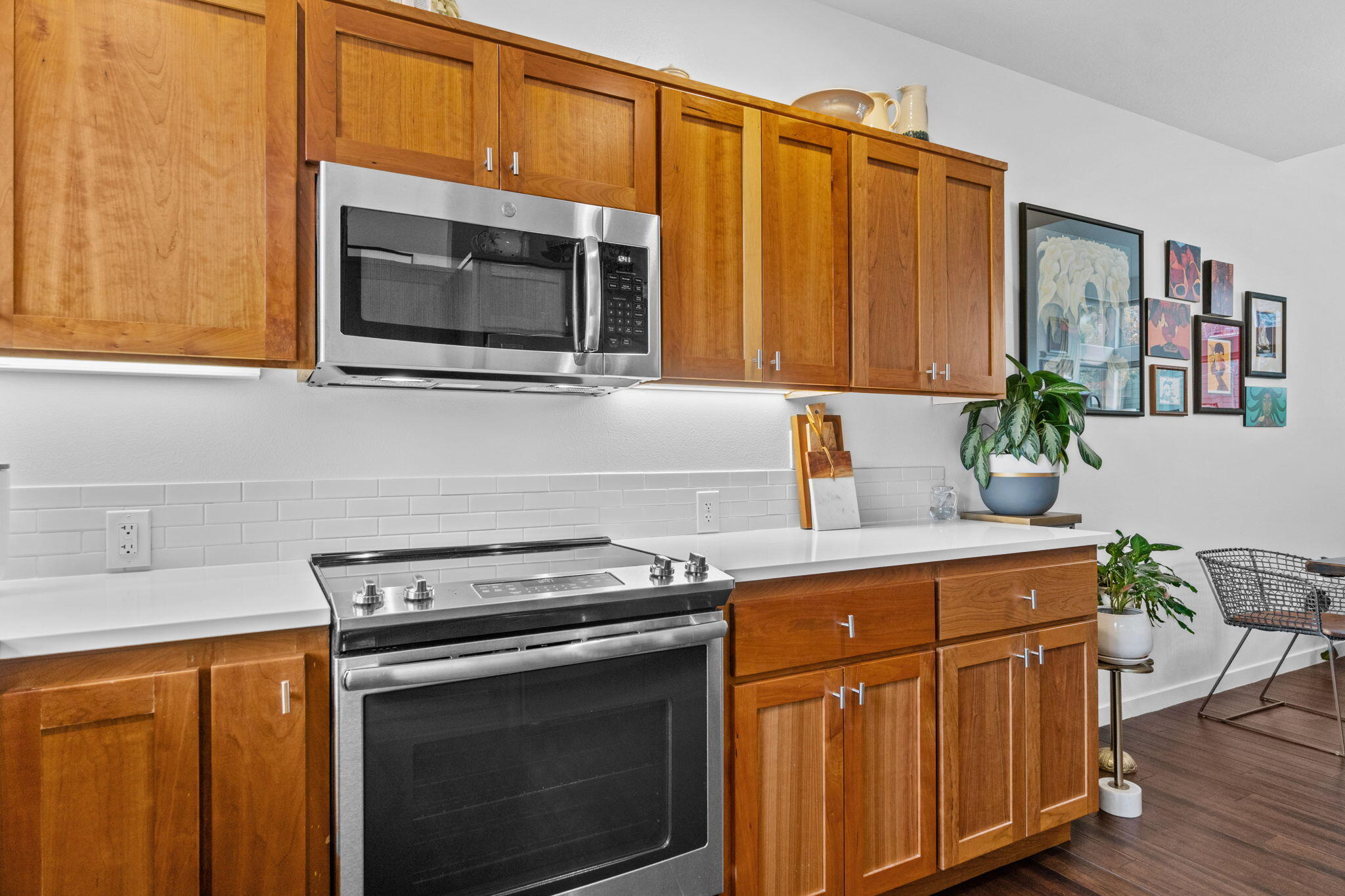 10942 Village Loop Redmond, OR 97756 - Photo 28 of 45 a kitchen with stainless steel appliances granite countertop a stove a microwave and a sink