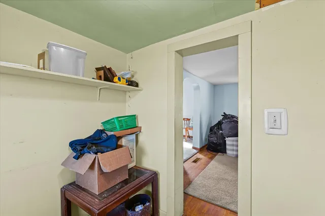 a view of living room with furniture and a gate