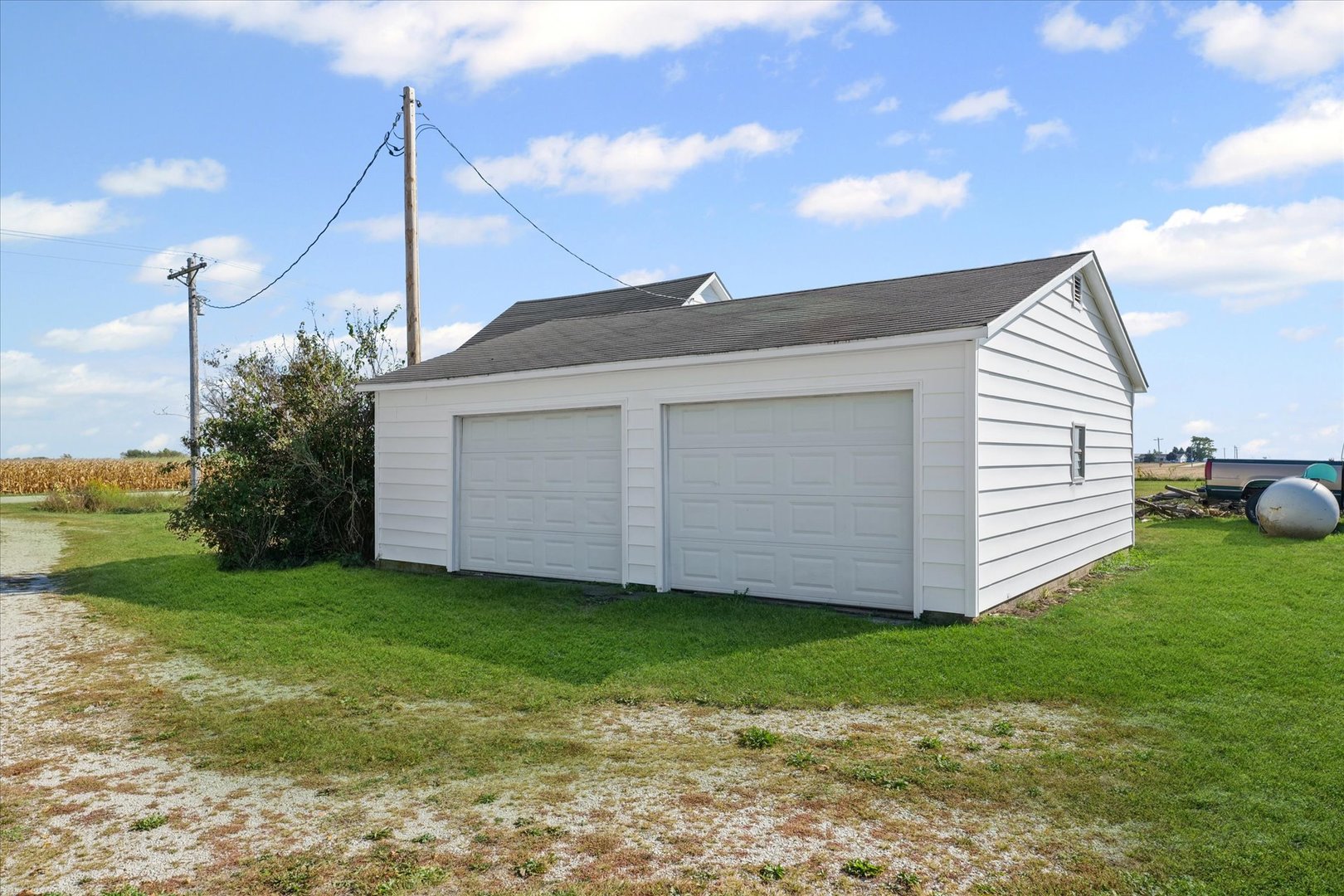 139 North 1500E Road Paxton, IL 60957 - Photo 22 of 49 a view of a house with backyard and a tree