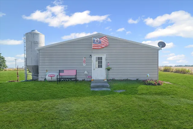a view of a house with a backyard