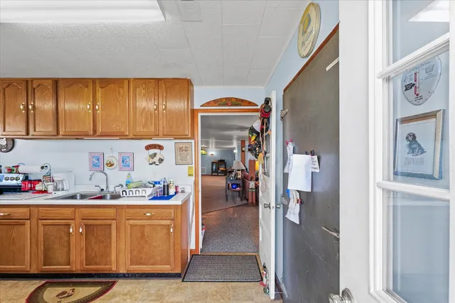 a kitchen with stainless steel appliances a refrigerator and cabinets