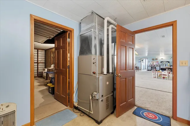 a view of a hallway with living room and furniture