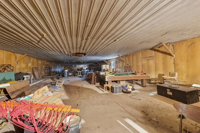 a view of a patio with table and chairs with wooden floor