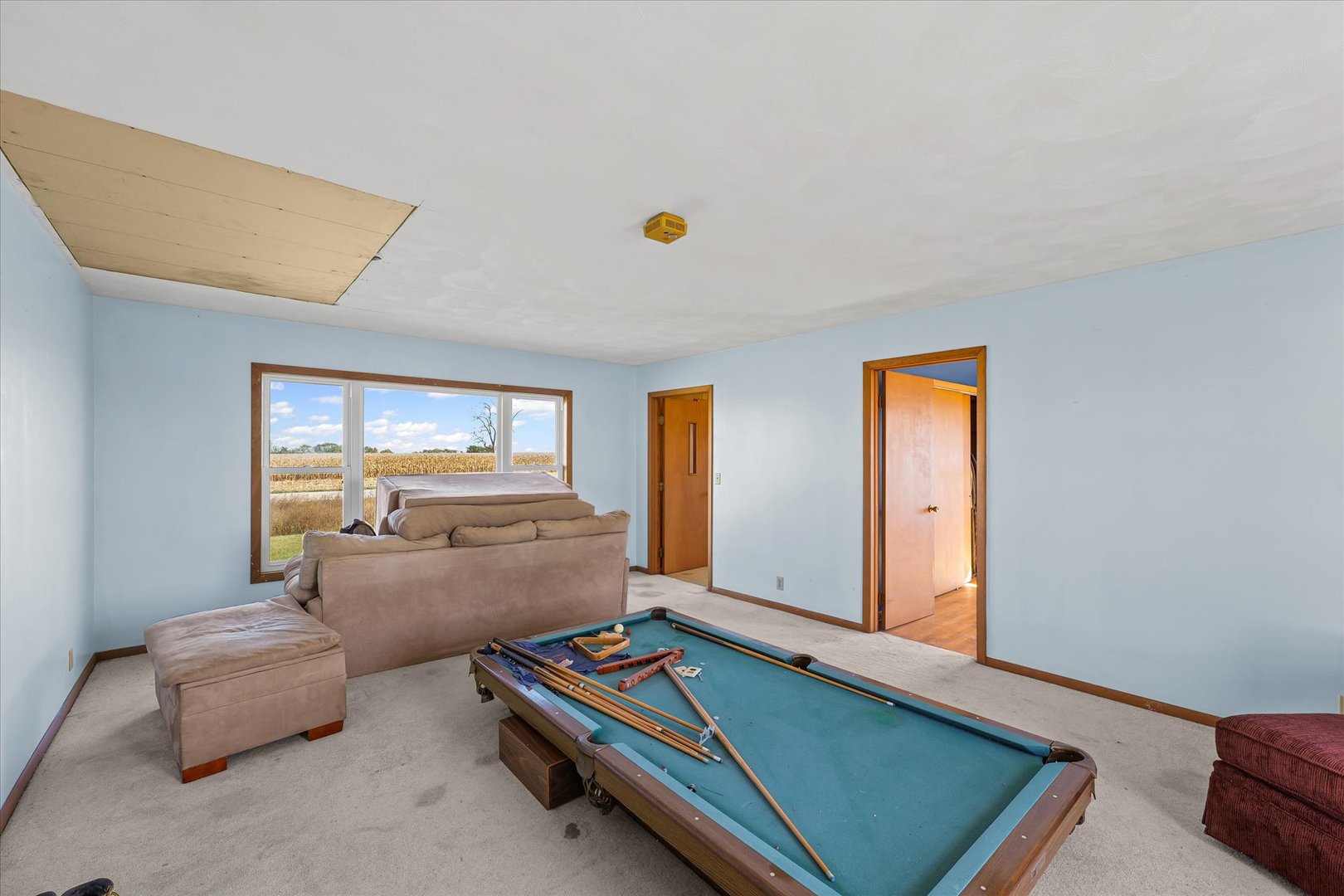 139 North 1500E Road Paxton, IL 60957 - Photo 6 of 49 a living room with furniture pool table and a window