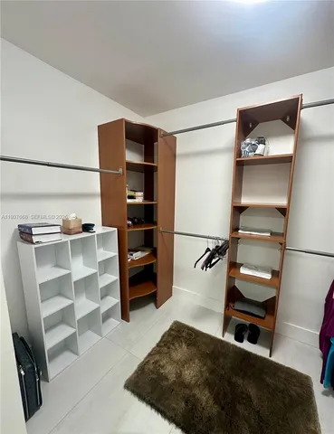 a bedroom with a bed and cabinets