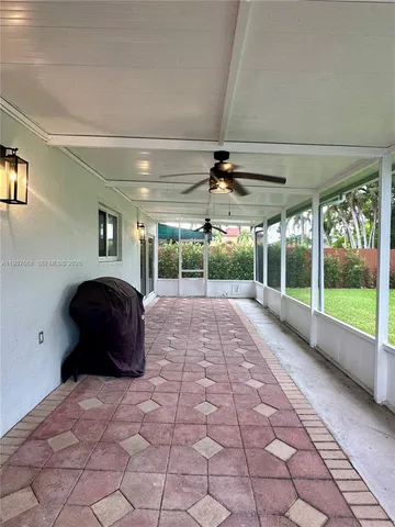 a room with a large bed and a large window