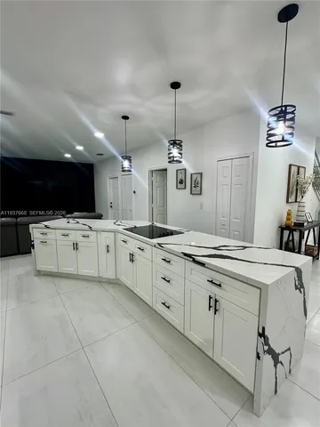 a large kitchen with cabinets