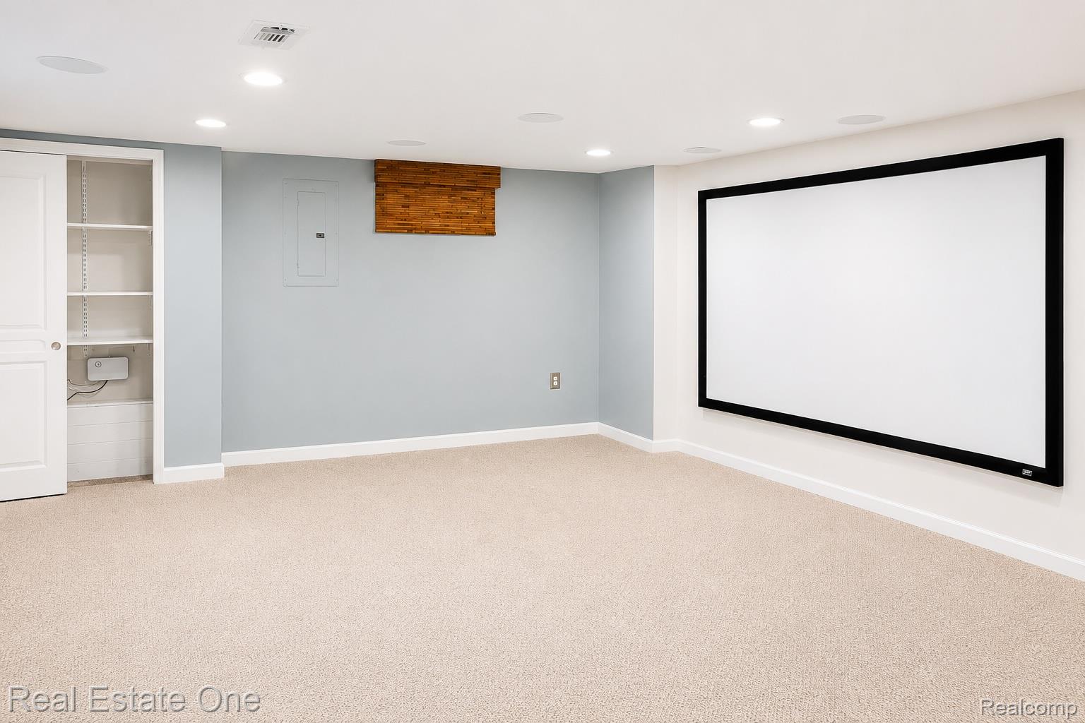 1141 Sandy Ridge Drive Rochester, MI 48306 - Photo 9 of 9 Entertainment space featuring a large projection screen and recessed lighting