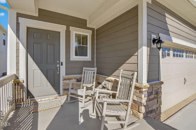a view of a hallway with wooden floor and entryway