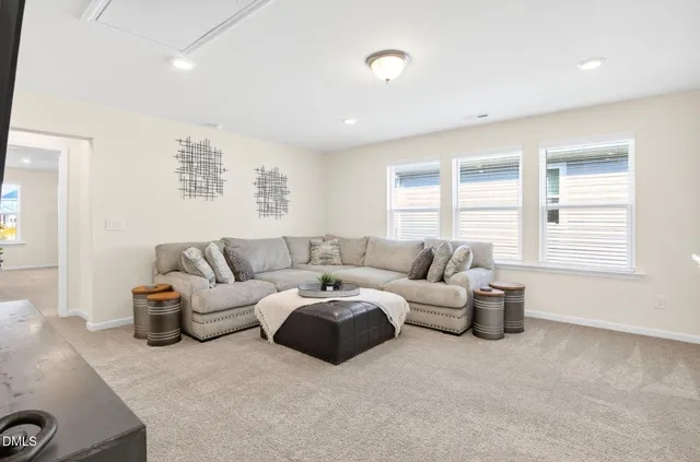 a spacious bathroom with double sink and a mirror