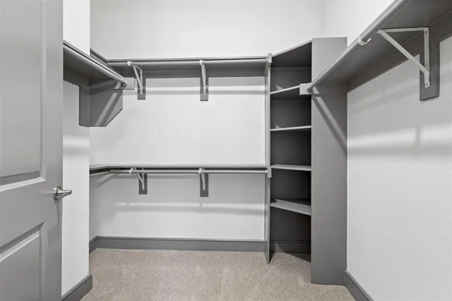 a view of an empty walk in closet