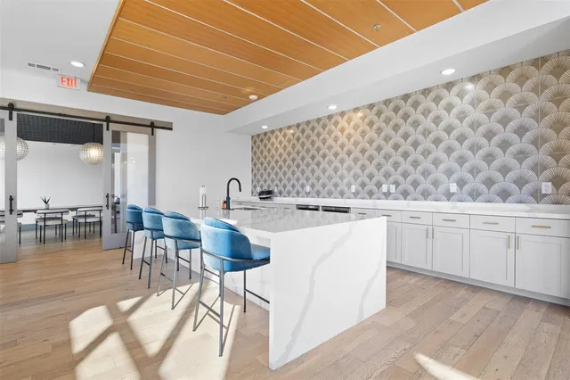 a outdoor space with lots of white furniture