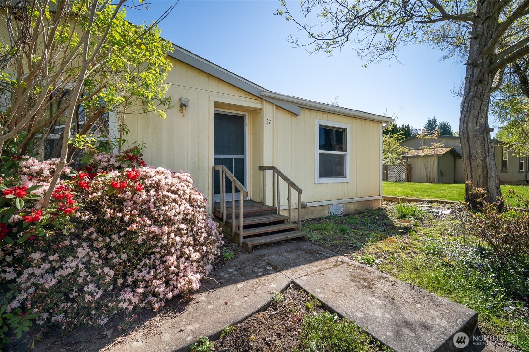 2350 Douglas Road, Unit 37 Ferndale, WA 98248 - Photo 14 of 40 front view of a house with a yard