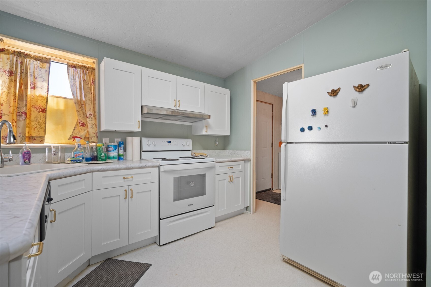 2350 Douglas Road, Unit 37 Ferndale, WA 98248 - Photo 23 of 40 a white refrigerator freezer sitting inside of a kitchen