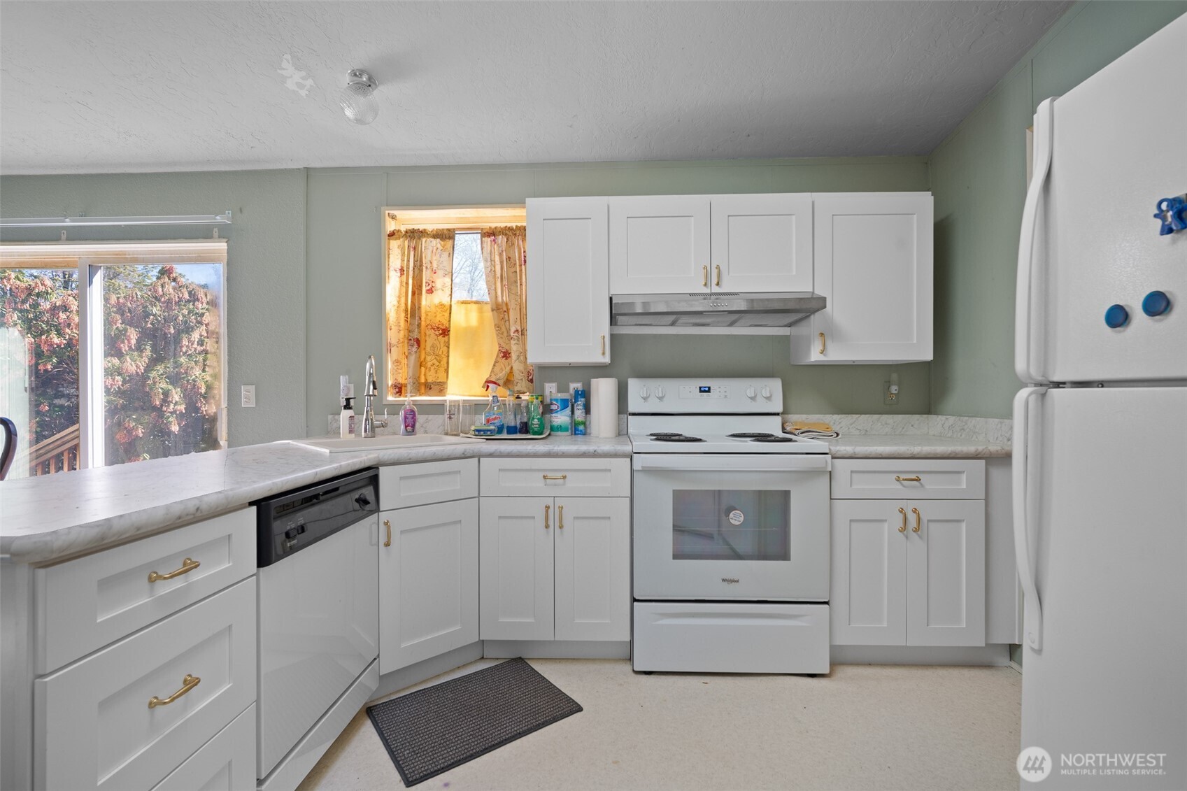 2350 Douglas Road, Unit 37 Ferndale, WA 98248 - Photo 24 of 40 a kitchen with granite countertop white cabinets and white appliances