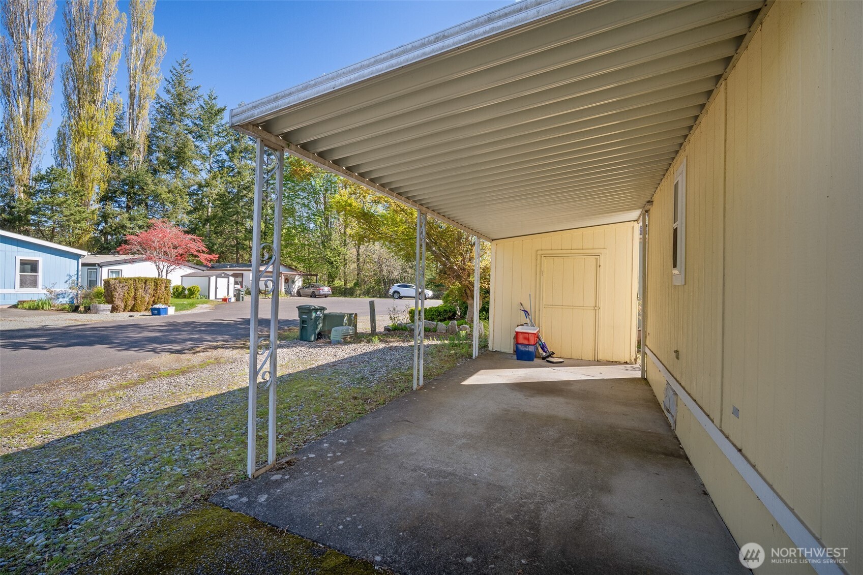 2350 Douglas Road, Unit 37 Ferndale, WA 98248 - Photo 9 of 40 a view of a patio with a table and chairs and floor to ceiling window