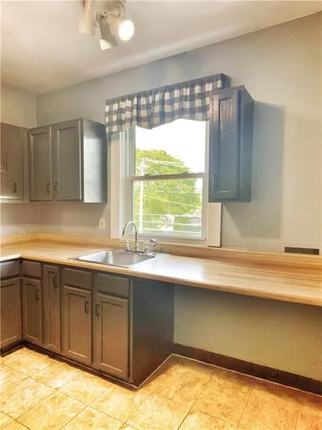 a kitchen with a sink and a window