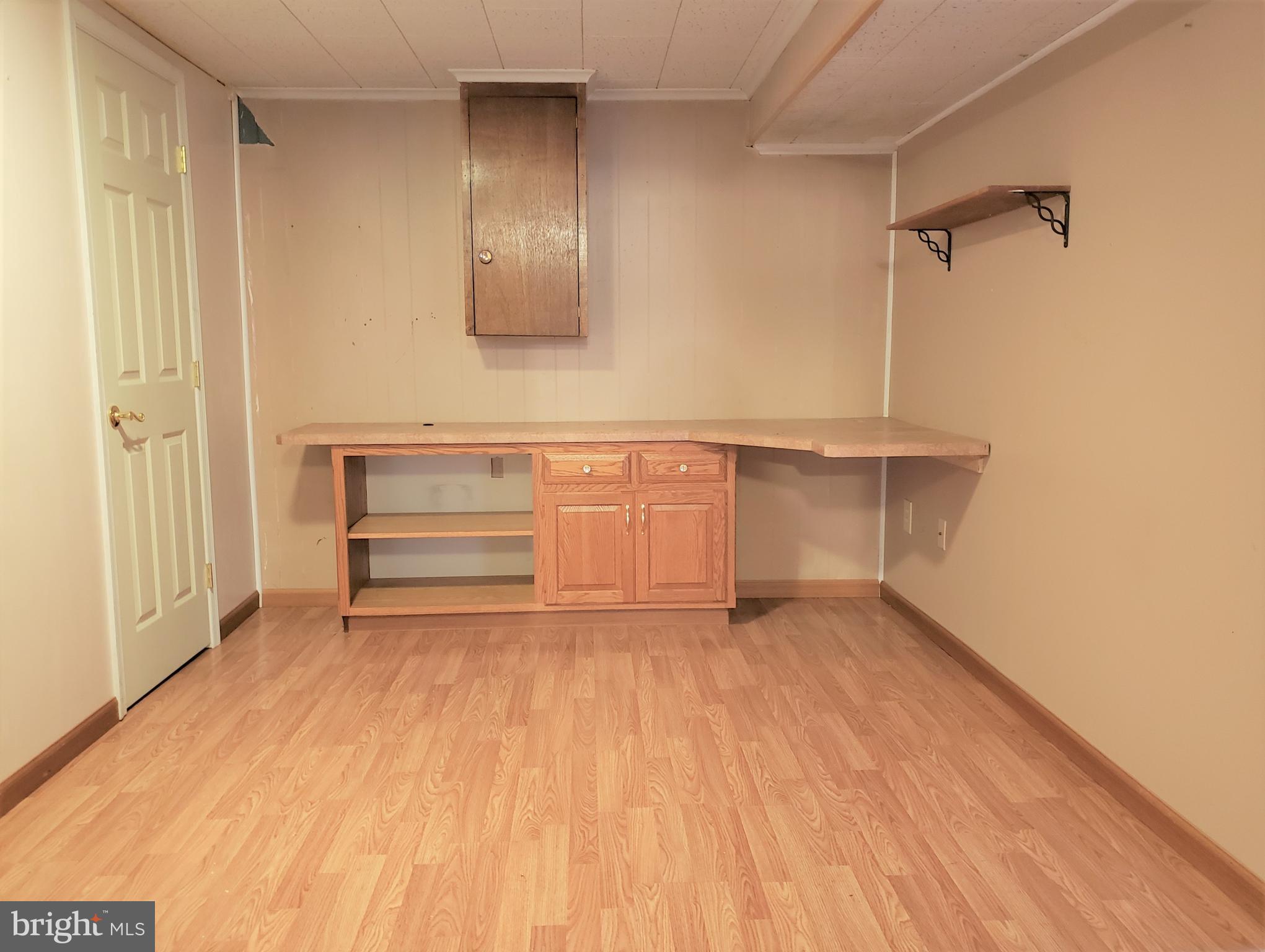 11510 Englewood Road Hagerstown, MD 21740 - Photo 24 of 35 Den with desk & full wall of walk-i storage