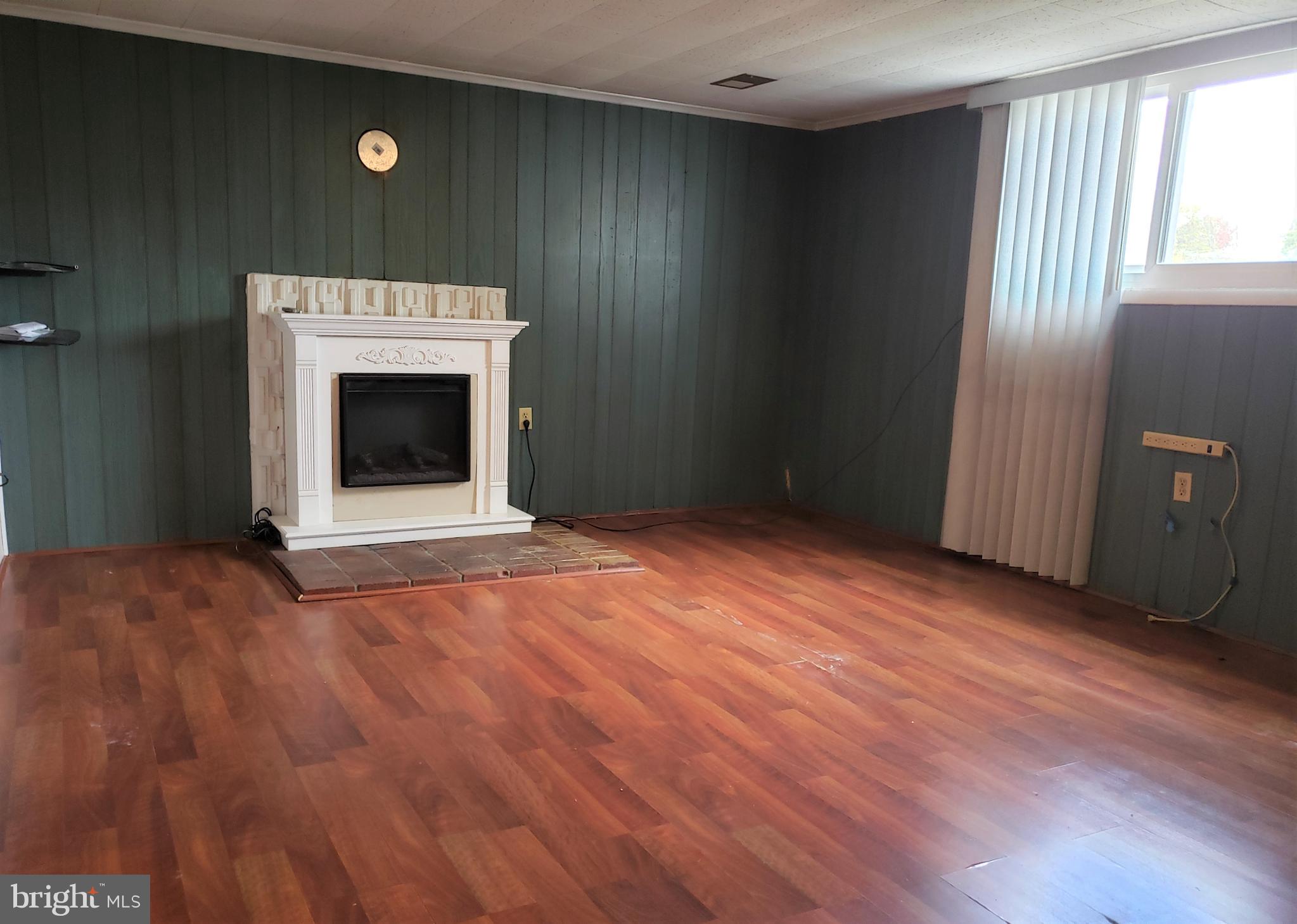 11510 Englewood Road Hagerstown, MD 21740 - Photo 26 of 35 Cozy family rec room with electric fireplace